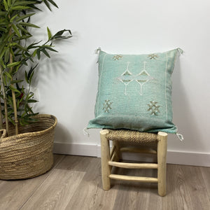 cojín seda de cactus turquesa escena